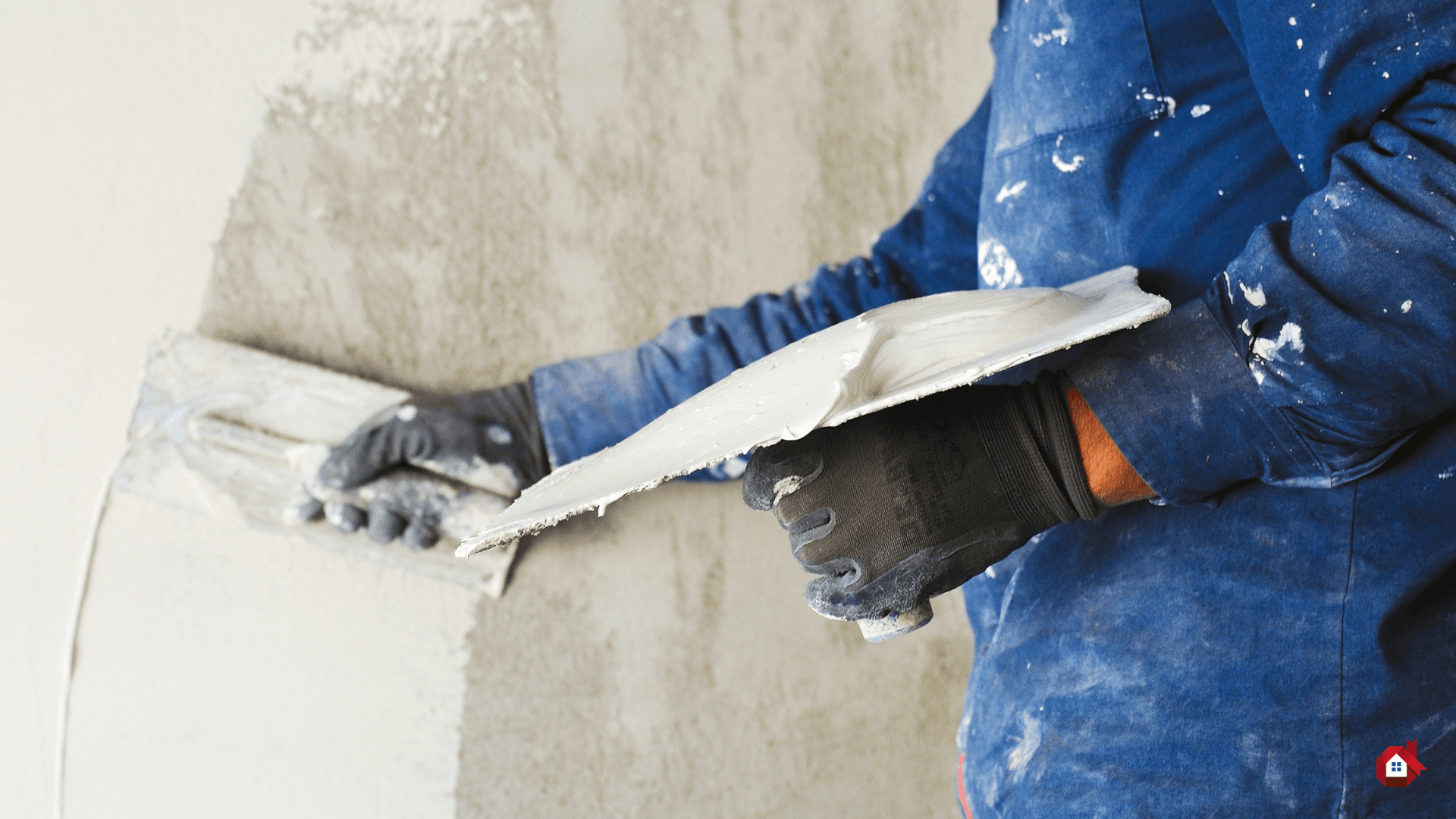 contractor plastering a wall