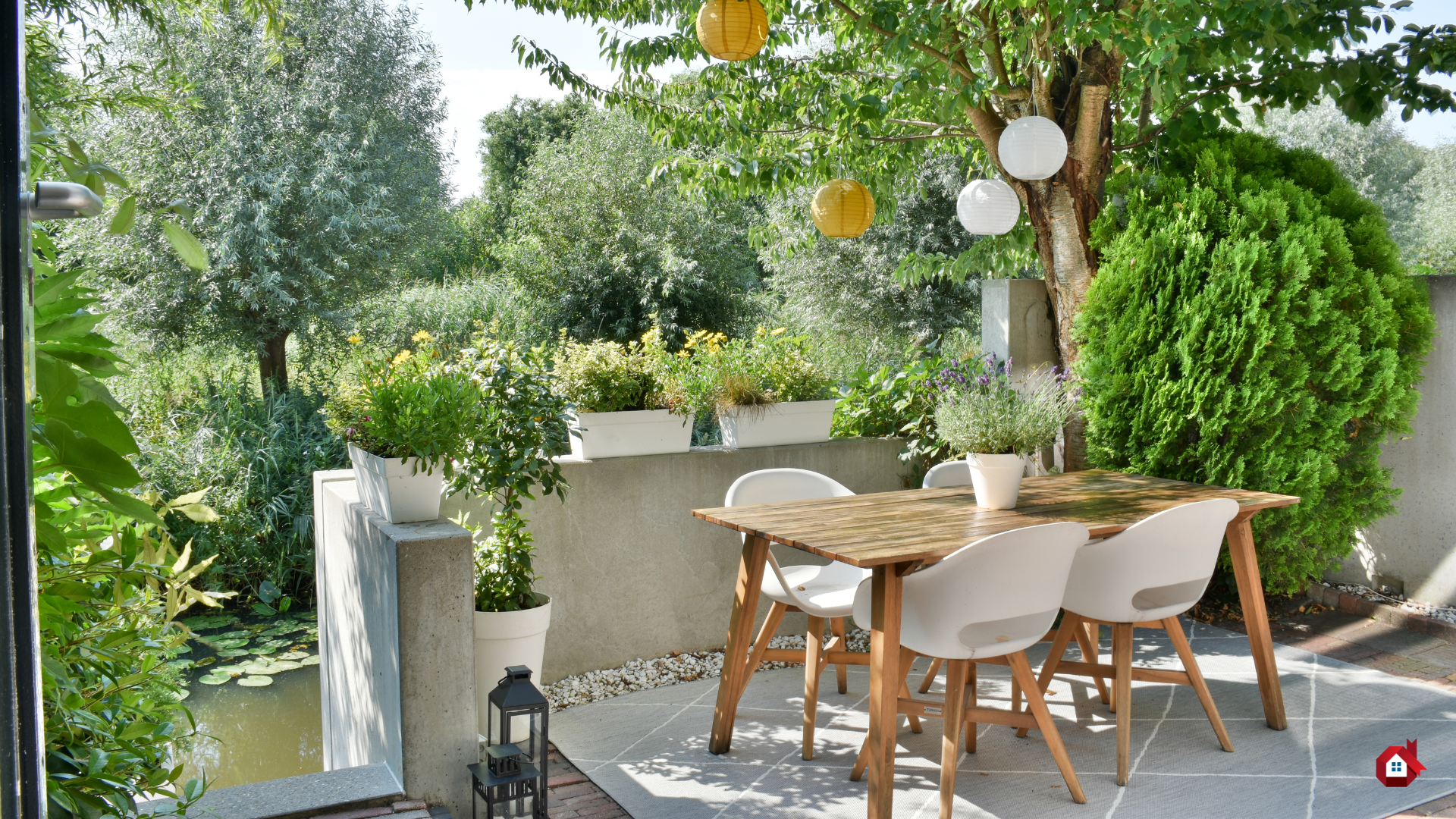tiled terrace with wooden table and tree 