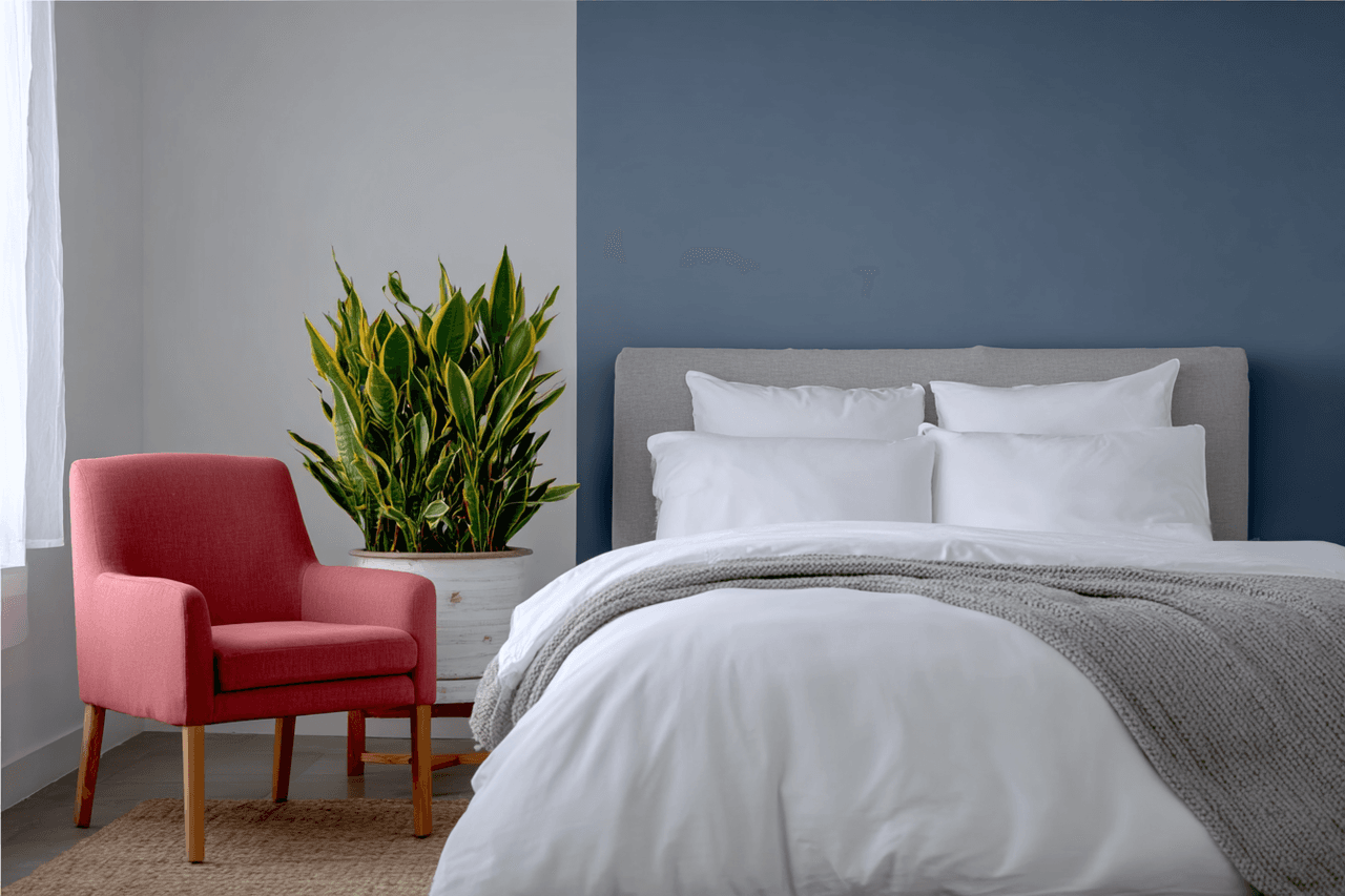 Woman peacefully sleeping under a soft grey fabric blanket