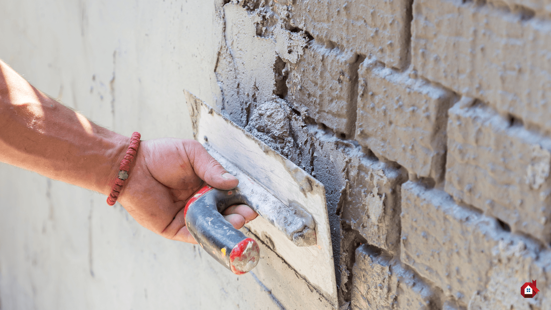 contractor plastering a wall