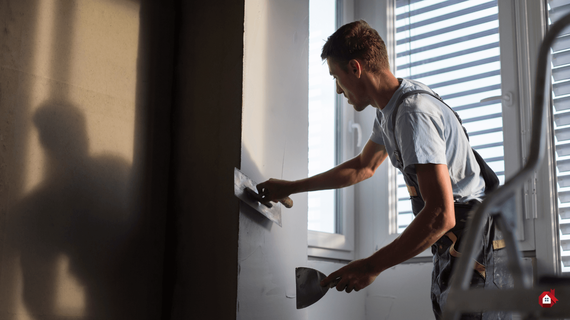 contractor plastering the wall