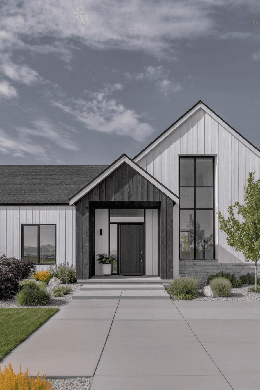 Modern house facade with white vertical siding and dark wood accents, front entrance with concrete steps and minimalist landscaping