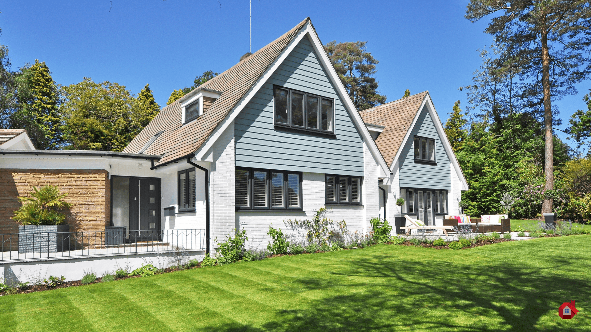 house with white brick and blue siding&nbsp;