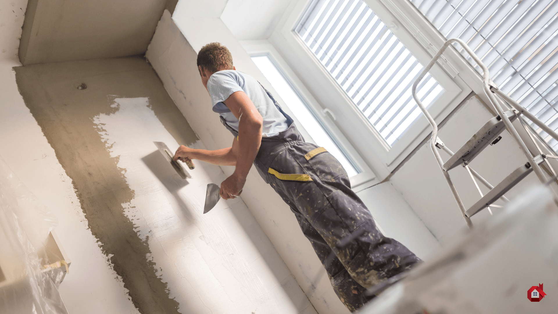 Contractor plastering the wall 