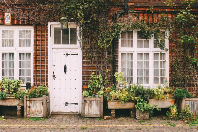 White front door on brick home