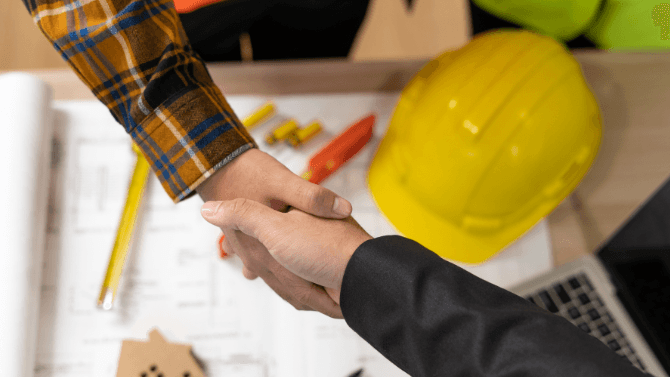 General contractor shaking hand with owner 