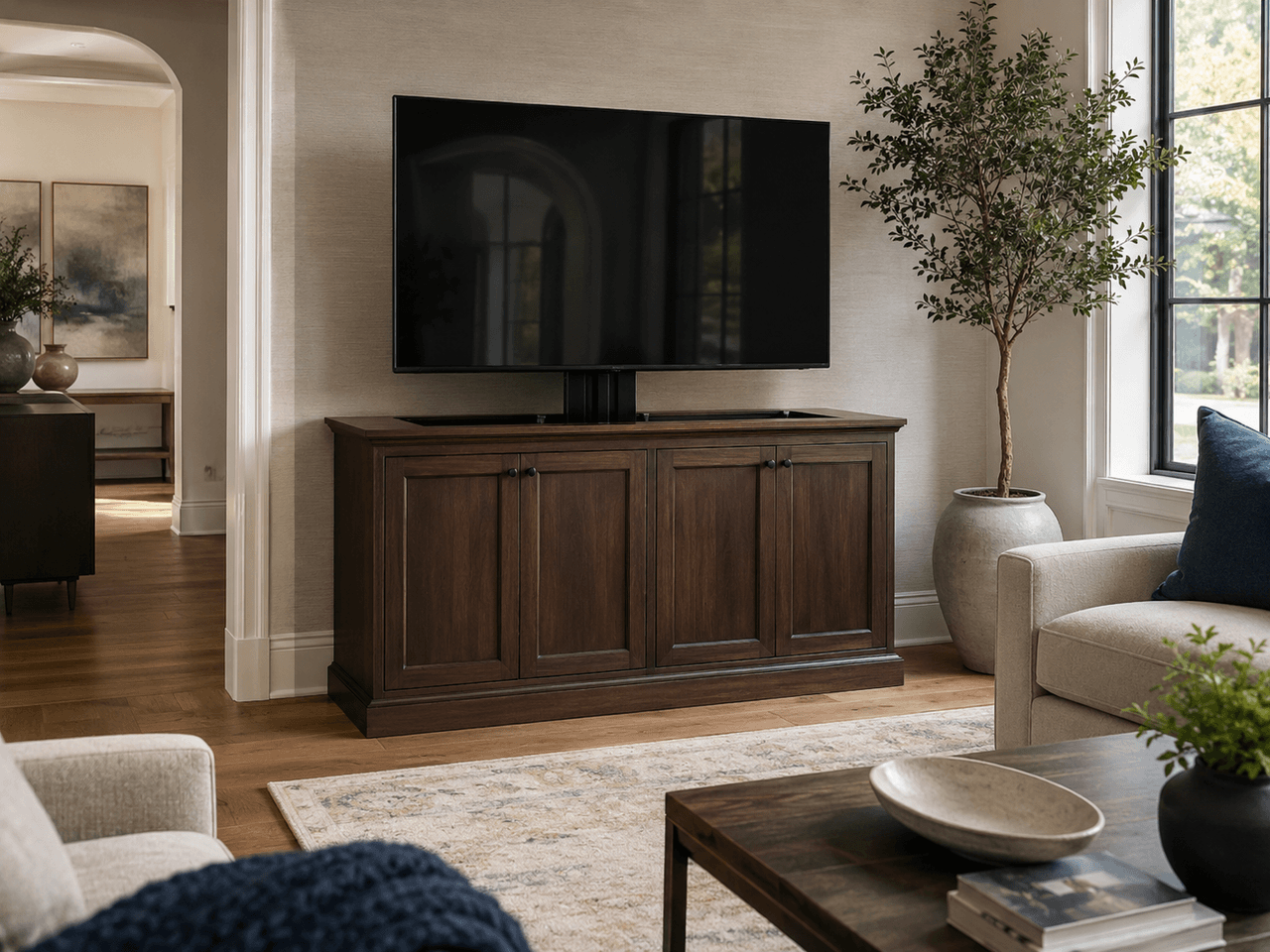 Modern living room with custom dark wood TV cabinet, flat-screen television, minimalist décor, and high-end finish