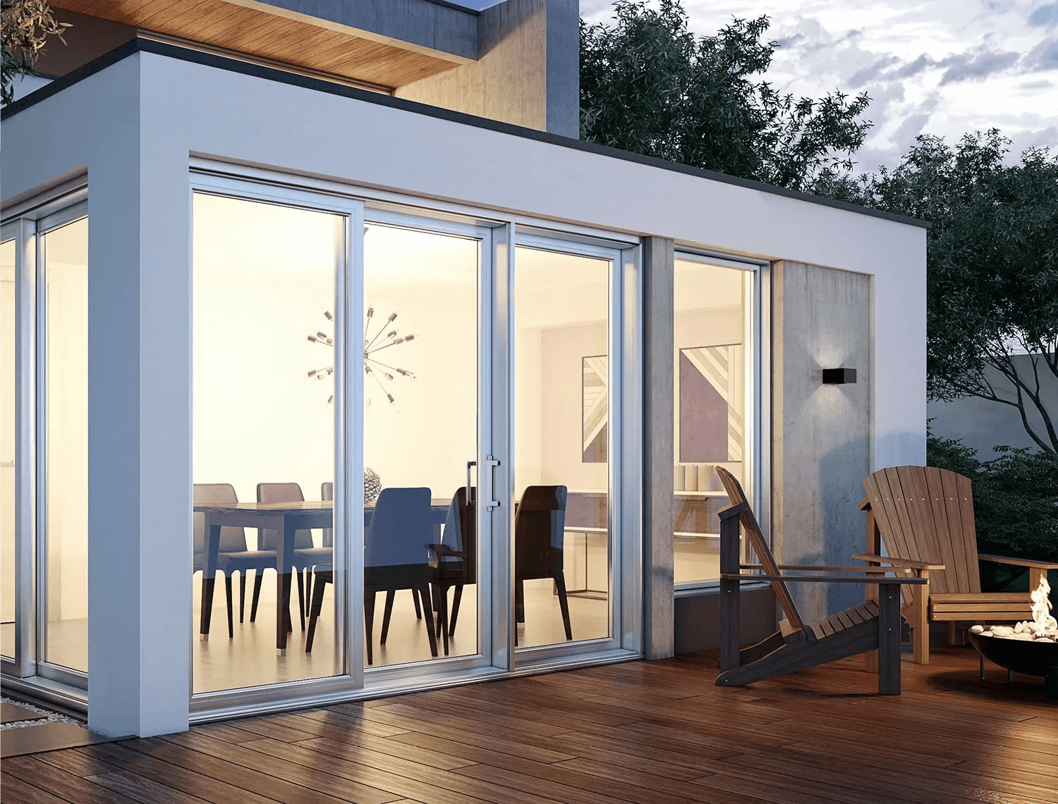 Modern residential extension with large glass doors and windows, contemporary white facade, wooden deck, Adirondack chairs and bright dining area.