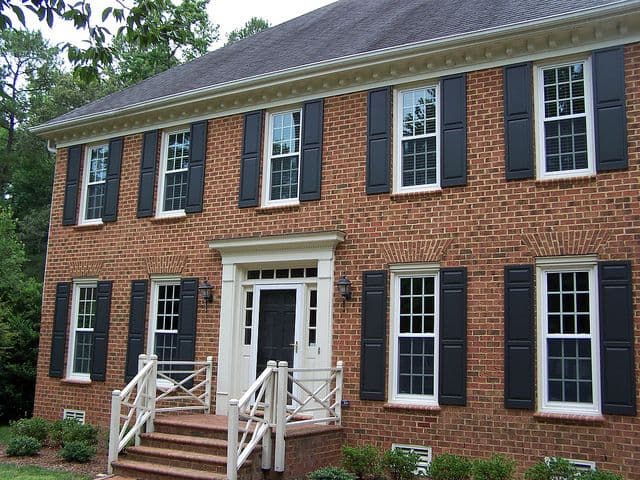 Brick house with double hung windows_RenoQuotes.com