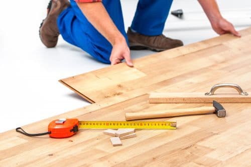 Man installing floorboards