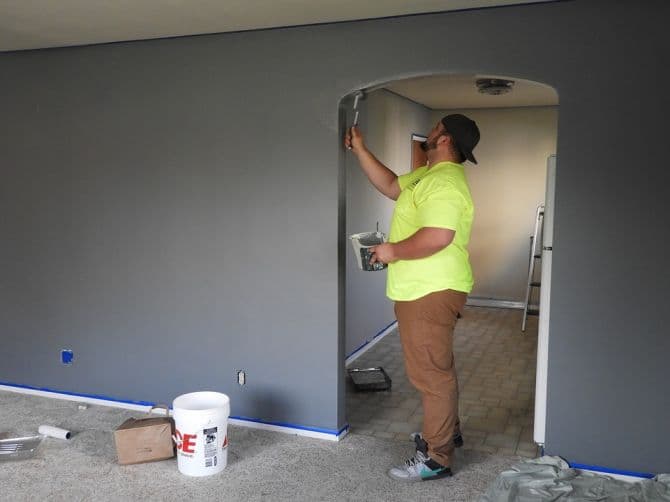 man painting a room_5 Renovation Projects Under $5,000