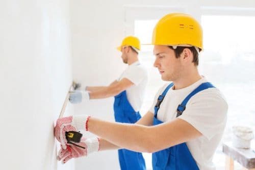 Contractors installing walls
