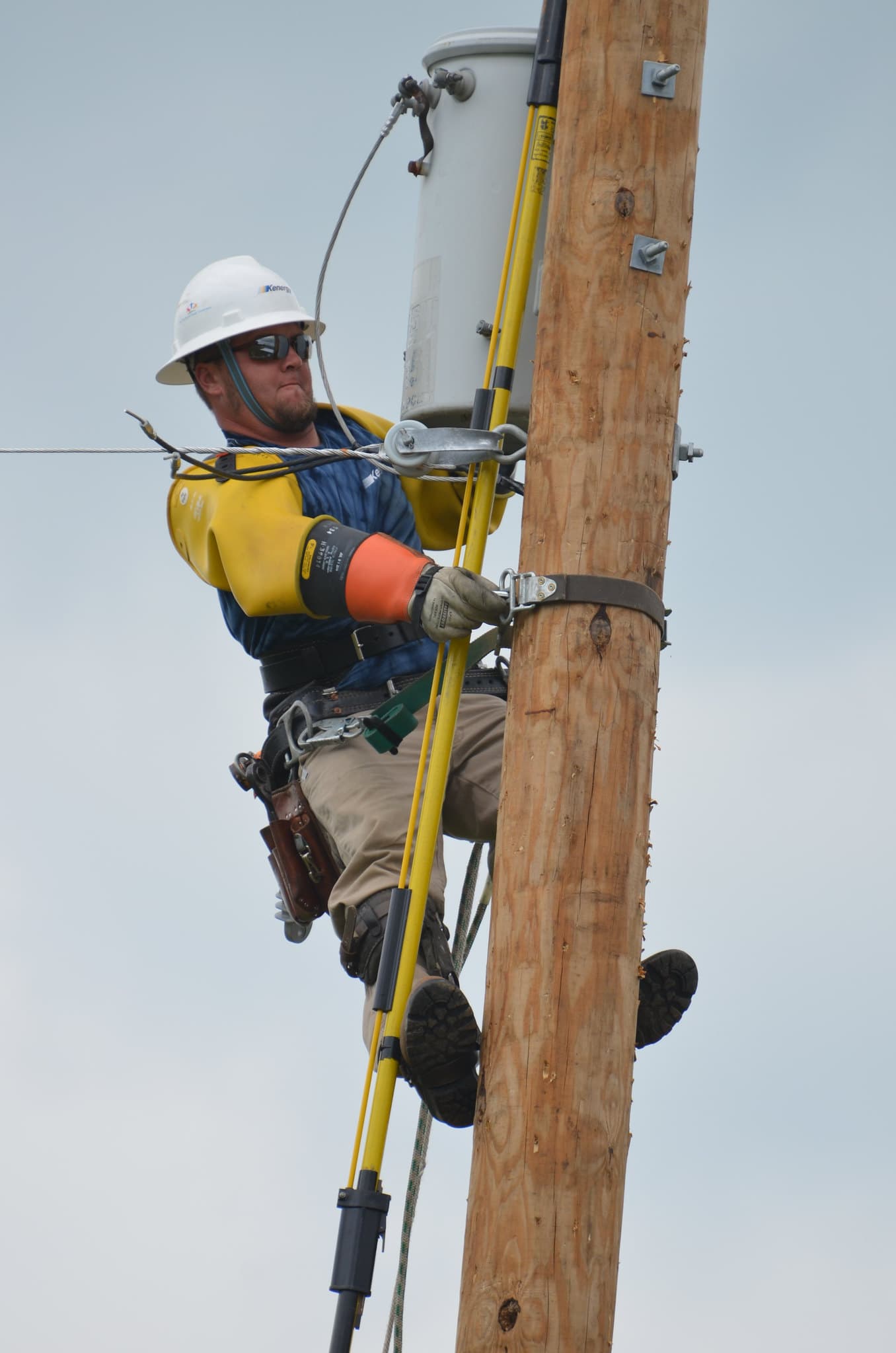 lineworker climbing utility pole_Lineworker: Ins and Outs of the Job
