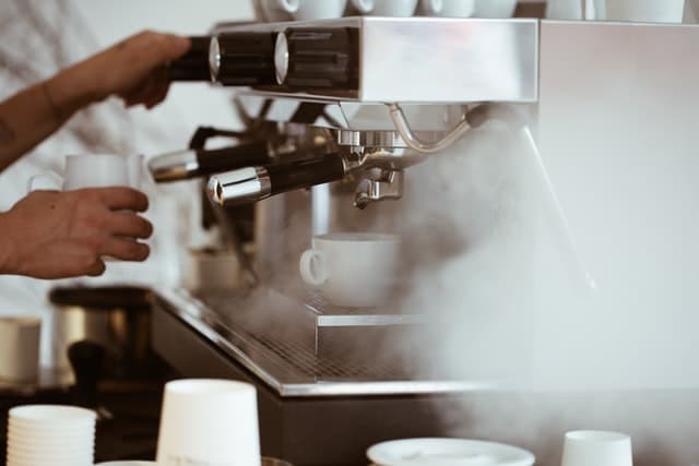 Person serving coffee