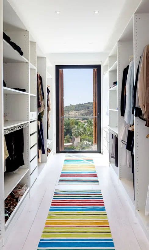 long walk-in closet with window_ Wardrobe and Closet layouts: 10 examples