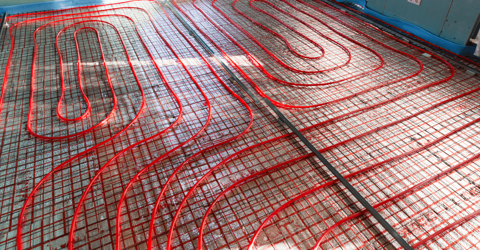 Red heating cables for electric underfloor heating system